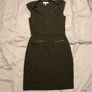 Black floral print Monteau tight fitted mini dress with gold faux zipper pockets